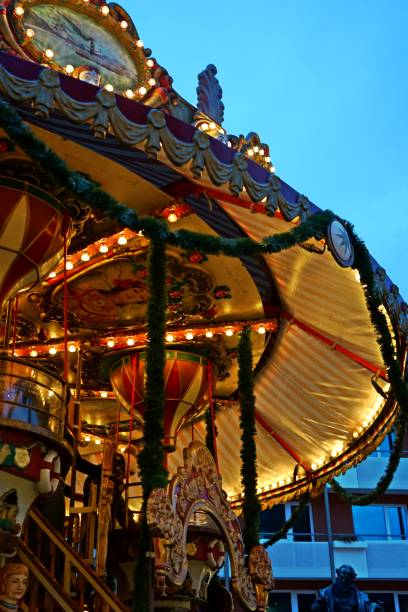 istock Christmas Carousel: Festive Lights Against the Winter Evening 2192137921
