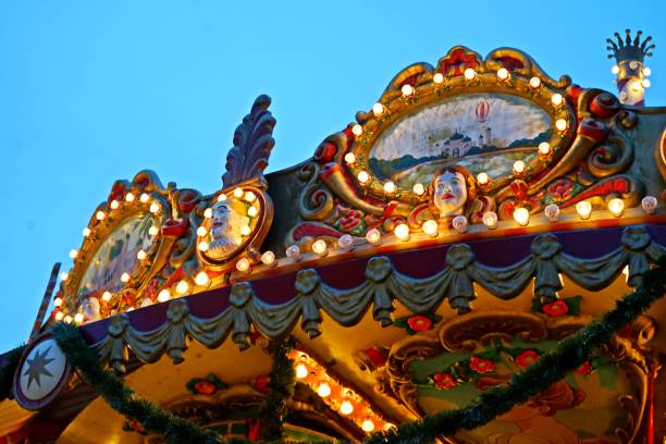 istock Christmas Carousel: Festive Lights Against the Winter Evening 2192138003