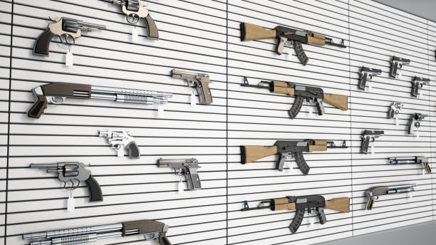 A collection of firearm replicas is showcased on a wall, featuring different types and styles.