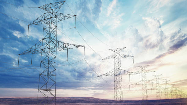 istock Power lines stretch across a vast landscape under a dramatic sky at sunset 2192138741