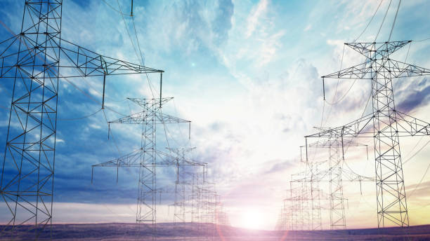 istock Power lines stretch across a vast landscape under a dramatic sky at sunset 2192138862