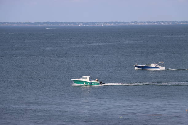 On August 19th 2024 , Houat island in Brittany, France. During summer holidays in France tourists come by boat to visit this beautiful island in Morbihan department.