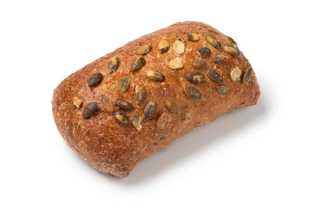 istock Single fresh homemade baked pumpkin seed bun on white background close up 2192142709