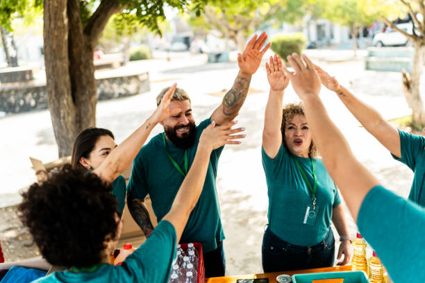 istock Volunteers celebrating outdoors 2192143607