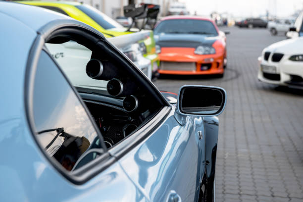 Blue, white and orange Toyota Supras; lime Green Mitsubishi Lancer Evo and white BMW M3. Odesa, Ukraine - May 07 2016.