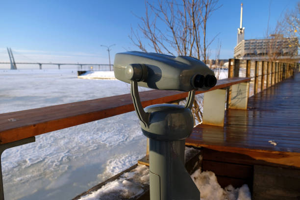 istock A stationary street gray binoculars installed on the waterfront overlooking the ice-covered Gulf of Finland 2192146042