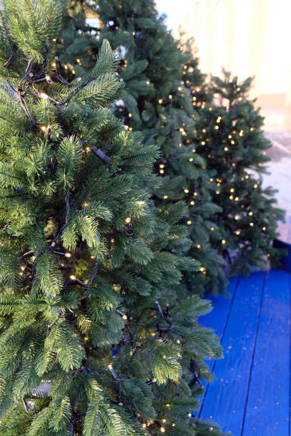 istock An artificial green Christmas tree decorated with garlands 2192146102