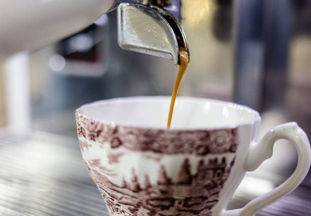 istock Espresso pouring into a vintage ceramic cup. 2192146954
