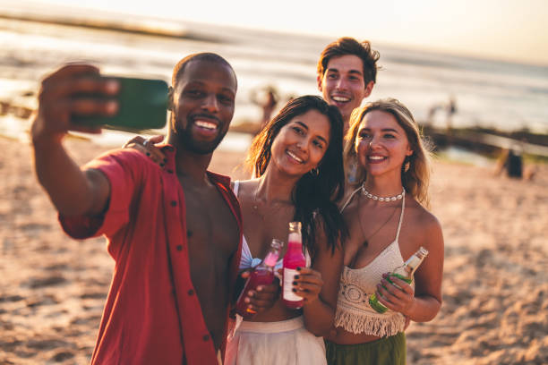 istock Friends taking a selfie on the beach during a sunny day 2192148809