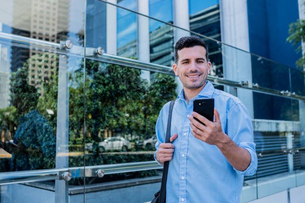 istock Businessman using mobile phone in the city 2192149404