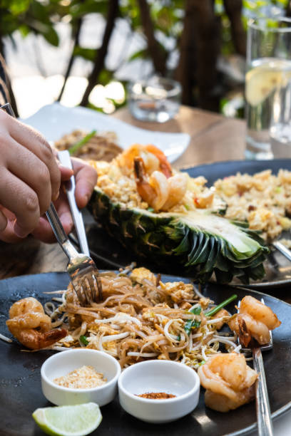 istock Pineapple Fried Rice with Prawns and Phad Thai Noodles Served in Authentic Thai Style 2192160662