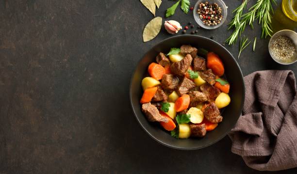 istock Beef stew with potatoes, carrots and greens 2192165235