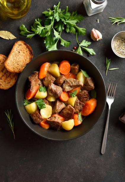 istock Beef stew with potatoes, carrots and greens 2192165245