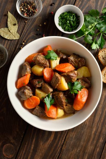 istock Beef meat stewed with potatoes, carrots and spices 2192165260