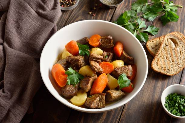 istock Beef meat stewed with potatoes, carrots and spices 2192165276