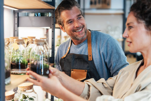 istock Handsome flower shop owner with client 2192165438