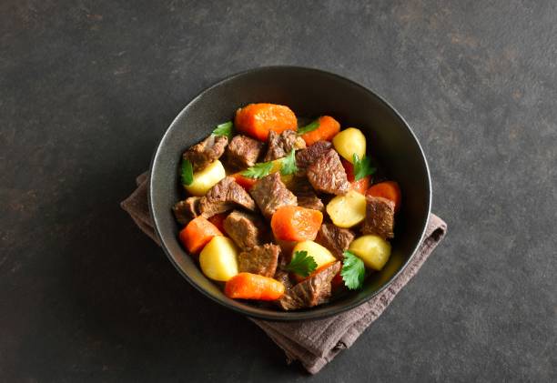 istock Beef stew with potatoes, carrots and greens 2192165470