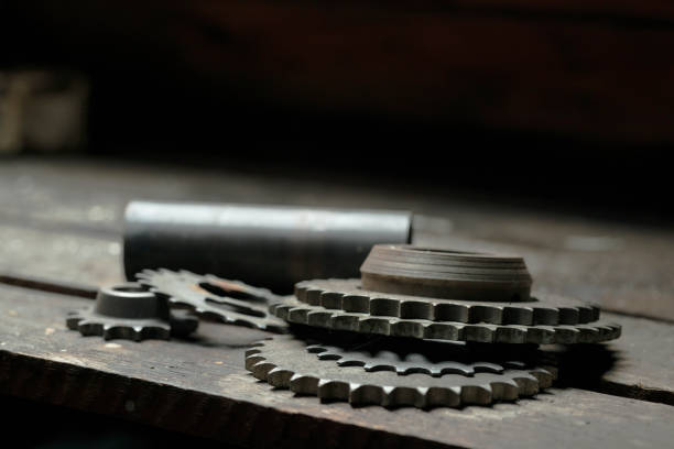 Used gearwheels on a wooden table