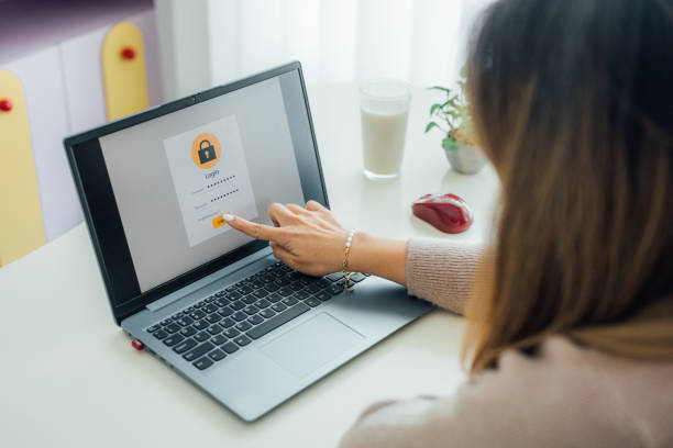 istock Cybersecurity in Action: A Woman Working with Password Safeguards 2192168744