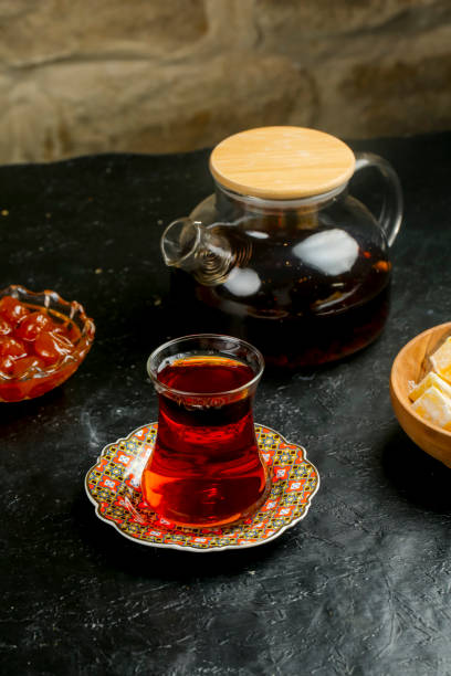 istock Warm tea served on a decorative plate with sweets in a cozy setting 2192170774