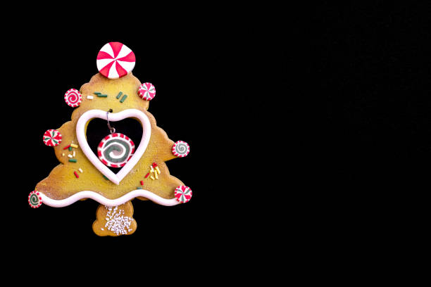 A decorative Christmas tree shaped figurine with cookie texture. Fun and childish style. Cookie texture, but it is made of plastic with bright colors.