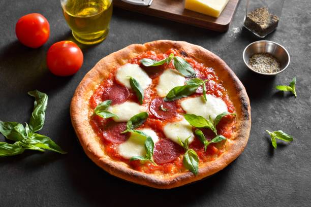 istock Pizza with mozzarella, pepperoni, tomato sauce and basil 2192173188