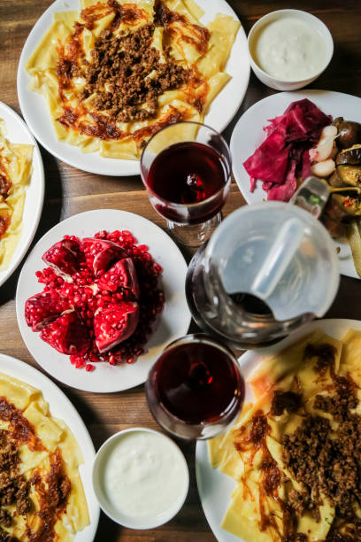 istock Delicious traditional dishes served on a wooden table with drinks 2192174223