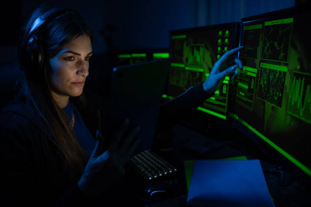 istock Female professional hacker is sitting by computer, conception of virus. 2192174345