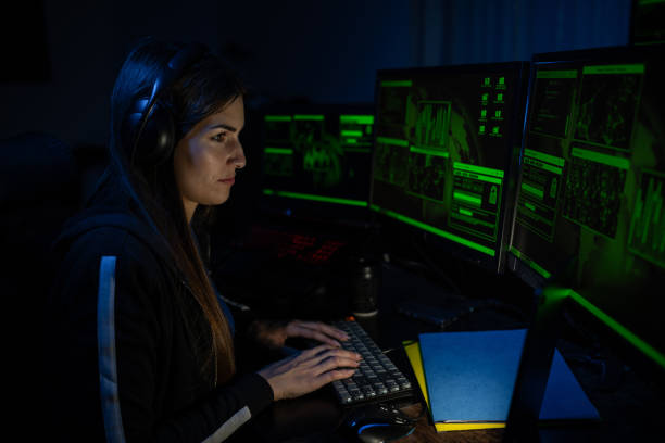 istock Female professional programmer and a hacker is sitting by computer, conception of virus. 2192174361