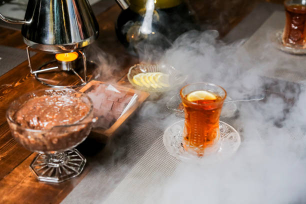 istock Unique tea experience with smoke and sweets at a cozy cafe setting 2192174798