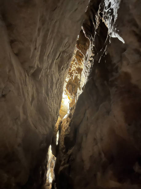 istock Dramatic Natural Rock Formation in an Underground Cave with Light Rays 2192175036