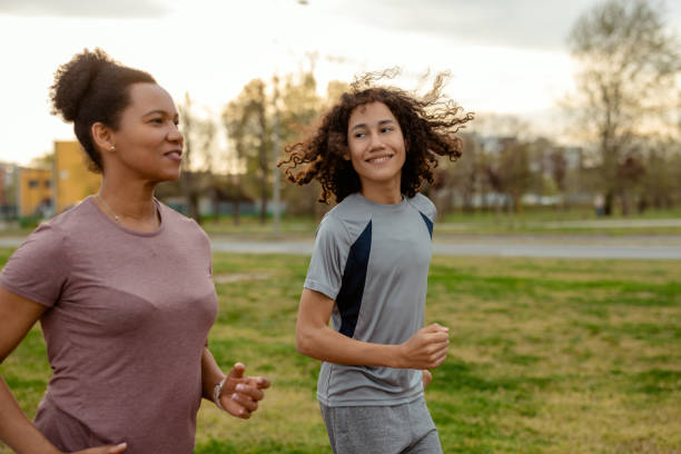 istock Family Fitness: Mother and Child Enjoying a Run Outdoors 2192177771