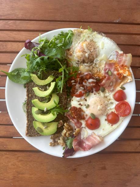 istock Avocado Sandwich with Fried Egg - sliced avocado and egg on toasted bread 2192180435