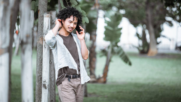 istock Man talking on phone in green park 2192180523