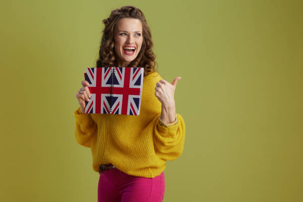 istock smiling modern woman isolated on green background 2192182715