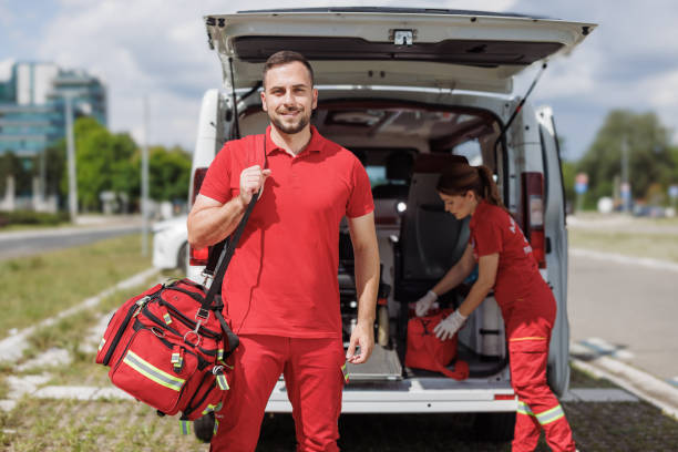 istock A paramedic standing in front of an ambulance, carrying a bag 2192183271
