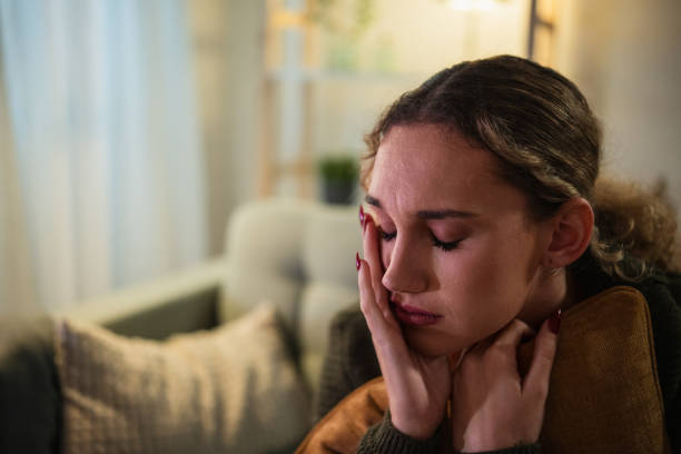 istock Young woman feeling sad and depressed at home 2192184131