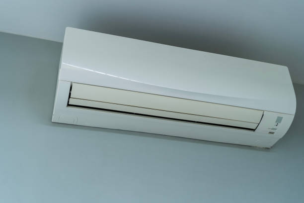 istock Air conditioner on white wall room interior background. Air conditioner with cold wind waves 2192188178