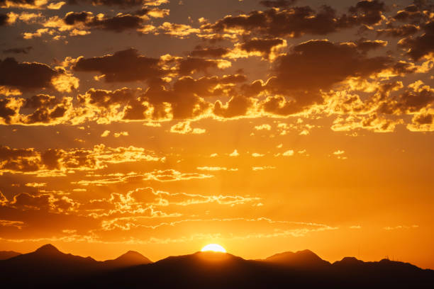 Sunrising behind the San Gabriel Mountains.  Photo taken from Rocky Peak Park near the Chatsworth area of Los Angeles California.
