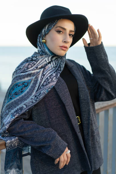 istock Stylish Young Muslim woman posing on the beach 2192189194