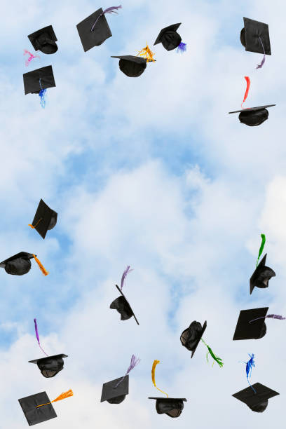 istock Graduation caps thrown in the sky 2192189349