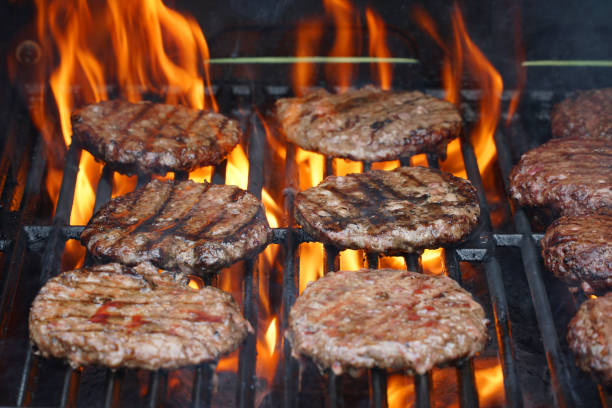 istock barbecue grill cooking burger steak on the fire 2192190558