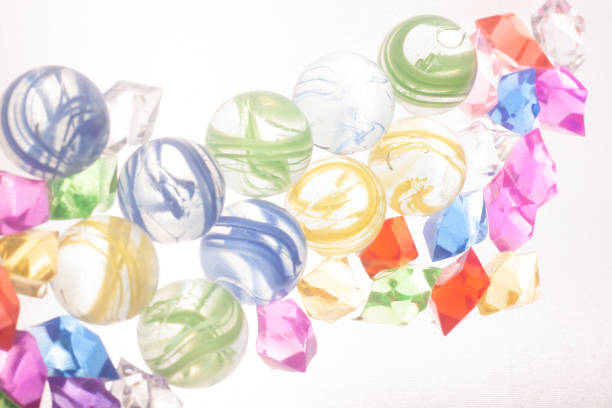 marbles dices and toys on a white background