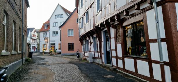 Flood-damaged road and old timber frame houses inside the old walled town of Bad Muenstereifel, Germany, December 2024