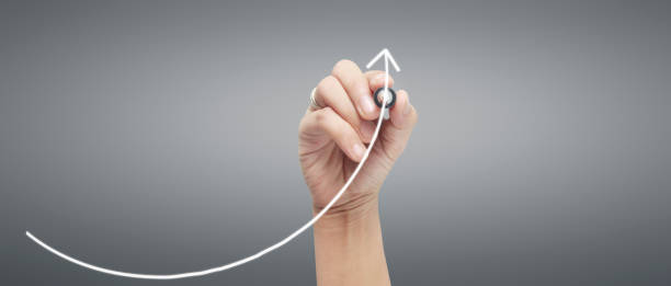 istock Male hand drawing graph chart showing business profit 2192193103