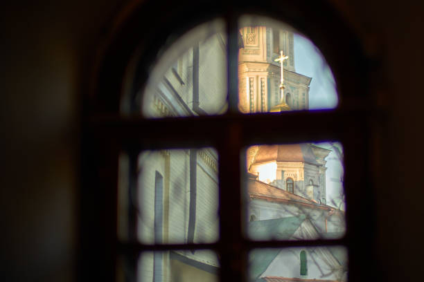 a beautiful stained glass window overlooking the ancient cathedral, giving it a unique charm