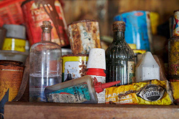 istock Collection of old tools and containers with rusted surfaces and worn details. Great-grandfather's abandoned workshop. 2192194400