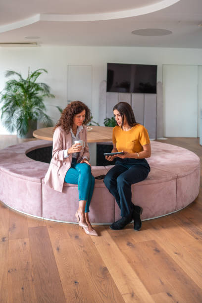 istock Caucasian and Hispanic Women Collaborating in Modern Office 2192200296