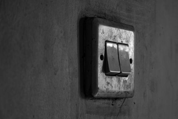 istock light switch on the wall of the house 2192202565