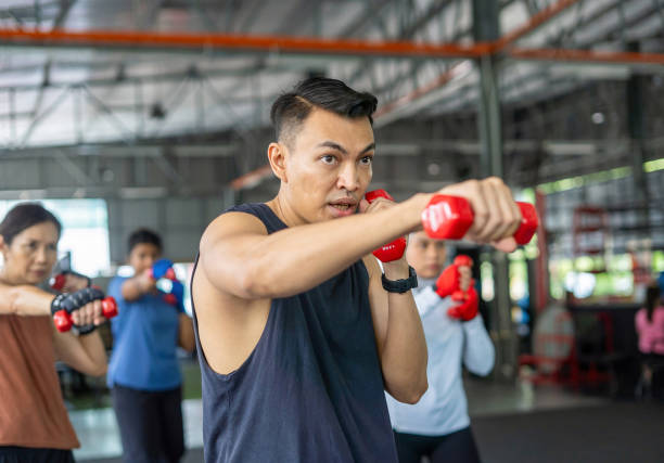 istock taebo - fitness coach in weight training class 2192205922